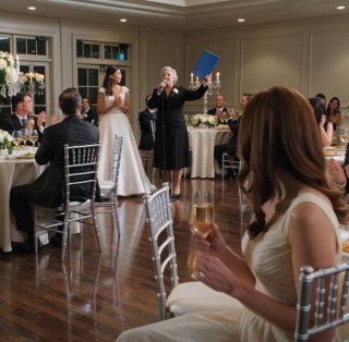 At my sister’s wedding, my mother lifted a blue folder and said, “We’re giving them our home,” while the whole room cheered for a gift I had spent five years paying for in silence — and when those same parents later decided they would move into my lake house next, they finally heard the one word they had trained me never to say.